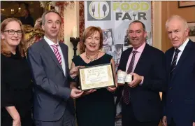  ??  ?? Norma and Willie Leahy, Carralea Dairy Products, Moyvane, County Kerry winner of the Best Emerging Artisan Award -Dairy Category, for their Strained Kefir pictured receiving their award from Victor Sheahan, LEO, Listowel, Jimmy Deenihan, Listowel Food...