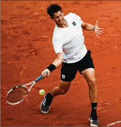  ?? THIBAULT CAMUS/ASSOCIATED PRESS ?? Austria’s Dominic Thiem plays a shot against Bolivia’s Hugo Dellien during Sunday’s first-round match at the French Open in Paris. Thiem was once ranked No. 3 but now is No. 194.