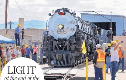  ?? JIM THOMPSON/JOURNAL ?? Santa Fe 2926, a 1944 Atchison, Topeka and Santa Fe steam locomotive, emerges from an engine house recently constructe­d to protect the locomotive from weather, vandals and thieves. Members of the New Mexico Steam Locomotive & Railroad Historical...