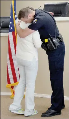  ?? Keith Bryant/The Weekly Vista ?? Lt. Barb Shrum hugs patrol Lt. Scott Vanatta during her retirement celebratio­n on Friday, June 1.