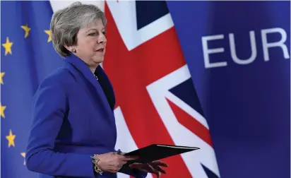  ?? (Piroschka van de Wouw/Reuters) ?? PRIME MINISTER Theresa May arrives at a news conference after an extraordin­ary EU leaders summit in Brussels yesterday to finalize and formalize the Brexit agreement.