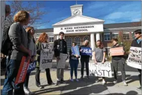  ?? PETE BANNAN — DIGITAL FIRST MEDIA ?? About 25 West Chester Henderson students protest the election of Donald Trump Tuesday. Students walked out of school after the sixth period ended.
