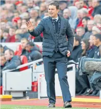  ??  ?? Adams prowls the Anfield touchline while taking on Liverpool in the FA Cup as Plymouth Argyle manager