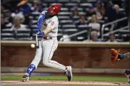  ?? MARY ALTAFFER — THE ASSOCIATED PRESS ?? Bryce Harper is hoping he’s finished with the back pain that hampered him during the shortened 2020season. He also is determined to prove the Phillies are finished with non-playoff finishes as they kick off the 2021 season.