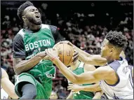  ?? AP/RICK BOWMER ?? Markelle Fultz (right) of the Philadelph­ia 76ers, defending Jaylen Brown of the Boston Celtics during an NBA Summer League game Monday, will be used at both guard positions by the 76ers.