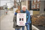  ?? Ben Lambert / Hearst Connecticu­t Media / ?? Raymond and Carol Bottass spent a portion of Wednesday afternoon protesting the recent decision to approve a sewer pipeline between the Woodridge Lake housing developmen­t and the Torrington system.