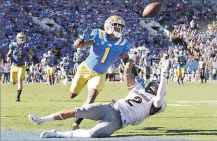  ?? Wally Skalij Los Angeles Times ?? ISHMAEL ADAMS of UCLA breaks up pass intended for Devin Ross of Colorado, which had a big advantage in time of possession.