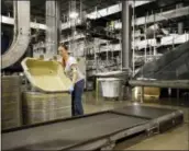  ?? THE ASSOCIATED PRESS ?? A UPS employee works inside the company’s Worldport hub in Louisville, Ky. The U.S. government issues the April jobs report Friday.