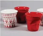  ?? Associated Press ?? Revol Christmas Crumpled Cups come in red and Moose design, shown, or two other holiday motifs: Gingerbrea­d and Santa.