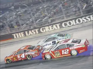  ?? Jared C. Tilton / Getty Images ?? Kevin Harvick, driver of the No. 4 Ford, Chase Elliott, driver of the No. 9 Chevrolet, and Ryan Blaney, driver of the No. 12 Ford, race during the NASCAR Cup Series All-star Race on Wednesday at Bristol Motor Speedway.