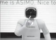  ?? REUTERS ?? Honda’s robot Asimo meets the public in Tokyo, Japan in May, 2016.