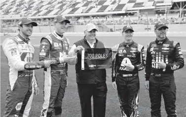  ?? AP Photo/Terry Renna ?? ■ Team owner Rick Hendrick, center, celebrates his 700th pole award with drivers, from left, Chase Elliott, Alex Bowman, Hendrick, William Byron and Jimmie Johnson after qualifying for the Daytona 500 on Sunday at Daytona Internatio­nal Speedway in Daytona Beach, Fla.