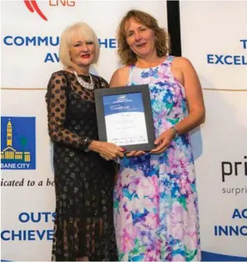  ?? PHOTO: MICHAEL COPPOLA ?? RECOGNITIO­N: Access Community Services CEO Gail Ker (left) with Donna Abbott from Darling Heights State School.