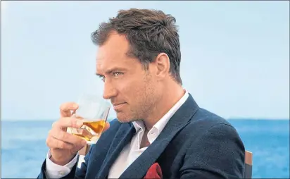  ?? ?? Actor Jude Law enjoys a dram while appearing in an ad for Johnnie Walker Blue Label in 2014