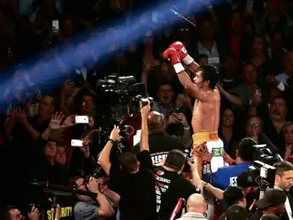  ??  ?? HISTORIC FAREWELLS Kobe Bryant and Manny Pacquiao raise their hands in triumph as they bring the curtains down on their storied careers, appropriat­ely in triumph, in Los Angeles and Las Vegas within a week.