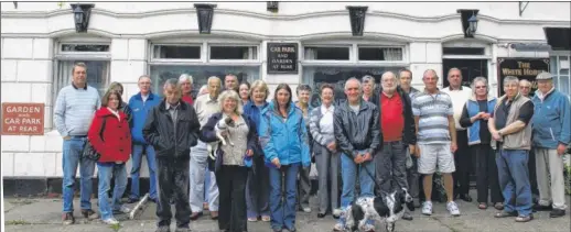  ??  ?? John Middleton, third from right, joins pub regulars in a campaign in 2010 to save The White Horse