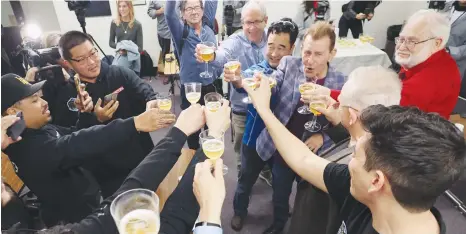  ?? (David Swanson/AFP via Getty Images) ?? MARKUS RUFER, President and CEO of Scorpius, and team members celebrate as the Spacecraft Odysseus lands on the moon from Scorpius Space Launch Company in Torrance, California, on Thursday.