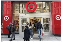  ?? (AP/Ted Shaffrey) ?? Shoppers leave a Target store in midtown Manhattan in New York in March.