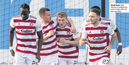  ??  ?? Goal hero Kyle Munro is mobbed by team-mates after his late equaliser