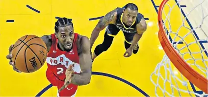  ??  ?? On the ball: Toronto Raptors’ Kawhi Leonard (left) in action against Golden State Warriors’ Andre Iguodala in the NBA Finals