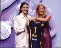  ?? SARAH STIER — GETTY IMAGES/TNS ?? Caitlin Clark poses with WNBA Commission­er Cathy Engelbert after being selected as the first overall pick by the Indiana Fever.