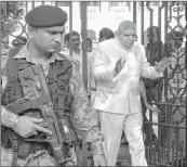  ??  ?? WB Governor Jagdeep Dhankhar being escorted by CRPF jawans as he comes out from state assembly during his visit.