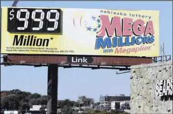  ?? Nati Harnik The Associated Press ?? A Mega Millions billboard in Omaha, Neb., shows $999 million, the maximum number the sign can show, ahead of the lottery draw Friday.