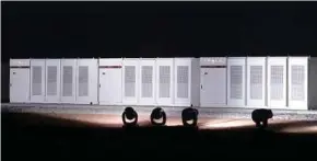  ?? BLOOMBERG PIC ?? Tesla Inc Powerpacks installed at the Hornsdale wind farm in South Australia.