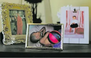  ?? PAUL SANCYA/ASSOCIATED PRESS FILE PHOTO ?? A family photo shows Emoni Bates sleeping with a basketball in Superior Township, Mich. ‘If the ball wasn’t around, he would cry about the ball,’ Bates’ father, E.J. Bates, said. ‘Even to this day, he has a mini-ball he keeps with him, which is crazy to me.’