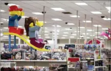  ?? AP PHOTO/JULIO CORTEZ ?? A display shows two large Lego toys on a slide near the toy section at a Target store in Bridgewate­r, N.J.