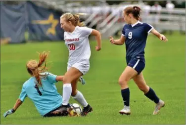  ?? KYLE FRANKO — TRENTONIAN PHOTO ?? Nottingham goalkeeper Sara Haas (1) slides to stop an attempt by Allentown’s Olivia Ricci (30) as Nottingham’s Meghan Fowler (9) chases the play during Thursday’s game. Story, Page 36.