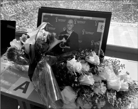  ?? GRAHAM DUNBAR / ASSOCIATED PRESS ?? A tribute to journalist Grant Wahl is placed on his previously assigned seat at the World Cup quarterfin­al soccer match between England and France on Dec. 10 at the Al Bayt Stadium in Al Khor, Qatar. Wahl, one of the most wellknown soccer writers in the United States, died early that day while covering the World Cup match between Argentina and the Netherland­s.