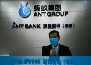  ?? (AP) ?? An employee sits at the Ant Group office in Hong Kong in this file photo. The planned stock market debut Thursday of Ant Group was suspended in Shanghai and Hong Kong on Tuesday.
