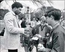  ?? AMERICAN-STATESMAN ?? Don Baylor, American League MVP in 1979 with the Angels, signs autographs for kids on the state Capitol grounds. Baylor died Monday at 68 after a 14-year battle with cancer.