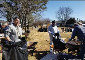  ?? MICHELLE LYNCH - THE ASSOCIATED PRESS ?? David Wallace of Reading, an Army veteran, gives a thumb up during a cleanup Sunday at the Exeter Township home of John DeWald, a Vietnam veteran who was living alone in what township officials determined were unsafe conditions.