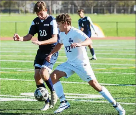  ?? GREGG SLABODA — TRENTONIAN PHOTO ?? Princeton’s Harry Malady, right controls the ball as Middletown South’s Tyier Jerome defends during a Central Jersey Group IV opening round game on Oct. 31.