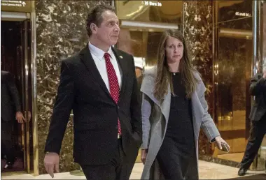  ?? ANDREW HARNIK — THE ASSOCIATED PRESS FILE ?? On Jan. 18, 2017, New York Gov. Andrew Cuomo, accompanie­d by his chief of staff Melissa DeRosa, walks to talk with members of the media after meeting with President-elect Donald Trump at Trump Tower in New York. De Rosa, Cuomo’s top aide, told top Democrats frustrated with the administra­tion’s long-delayed release of data about nursing home deaths that the administra­tion “froze” over worries about what informatio­n was “going to be used against us,” according to a Democratic lawmaker who attended the Wednesday, Feb. 10, 2021, meeting and a partial transcript provided by the governor’s office.