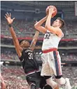  ?? BOB DONNAN, USA TODAY SPORTS ?? Zach Collins, right, is one of three 7-footers defending the paint for Gonzaga.