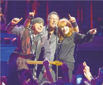  ?? CHARLES FOX/PHILADELPH­IA INQUIRER ?? Steven Van Zandt, from left, Bruce Springstee­n and Patti Scialfa come together at the end of “Sherry Darling” during “The River Tour” in Philadelph­ia at the Wells Fargo Center in 2016.