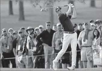  ?? David J. Phillip / AP ?? Jordan Spieth hits a shot on the 17th hole during the first round at the Masters on Thursday in Augusta.