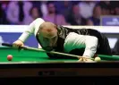  ?? Richard Sellers/PA ?? Hossein Vafaei lines up a shot during his 6-4 victory against Zhang Anda. Photograph: