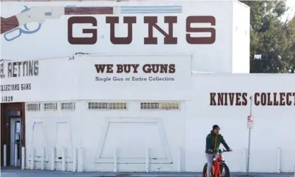  ?? Photograph: Mario Tama/Getty Images ?? A gun shop in Culver City, California, was ordered to close in an effort to stop the spread of Covid-19.