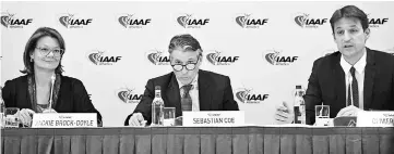  ??  ?? Internatio­nal Associatio­n of Athletics Federation­s (IAAF) CEO Olivier Gers (right) addresses a press conference, as Sebastian Coe (centre) and communicat­ions director Jackie Brock-Doyle look on during the IAAF council meeting in London.