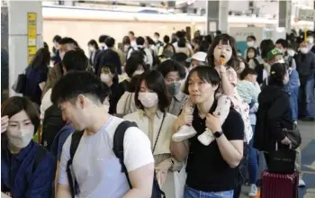  ?? Photo ?? A shinkansen bullet train platform at JR Tokyo Station was crowded with passengers as Japan entered the second half of the Golden Week holidays in early May.