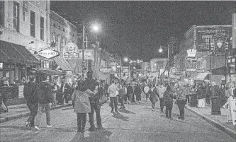  ??  ?? Downtown Memphis’s Beale St. is lined with blues clubs and restaurant­s.