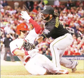  ??  ?? St Louis Cardinals’ Jon Jay is tagged out by Pittsburgh Pirates first baseman Sean Rodriguez to end the seventh inning
during a baseball game on May 1, in St Louis. (AP)