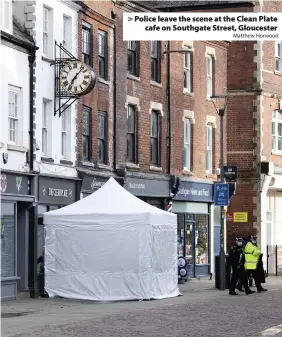  ?? Matthew Horwood ?? > Police leave the scene at the Clean Plate cafe on Southgate Street, Gloucester