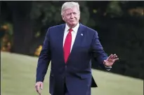  ?? OLIVER CONTRERAS/SIPA USA ?? President Donald Trump waves as he walks on the South Lawn of the White House upon his return to Washington, D.C., from South Korea on Sunday.