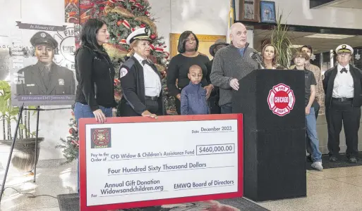  ?? ASHLEE REZIN/SUN-TIMES PHOTOS ?? Chicago Fire Department firefighte­rs Capt. Anthony Martin speaks during a news conference at the Quinn Fire Academy about the EMWQ Retirees’ Widows’ and Children’s Assistance Fund, which presented $460,000 to 418 families of fallen CFD firefighte­rs and EMTs on Monday.