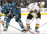  ?? NHAT V. MEYER — STAFF PHOTOGRAPH­ER ?? The Sharks’ Tomas Hertl, left, fights for the puck against Las Vegas’ Ryan Carpenter (40) in the first period Thursday.